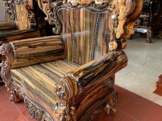 Bộ bàn ghế Hoàng Gia 2m6 gỗ mun hoa Lào vân hoa siêu đẹp